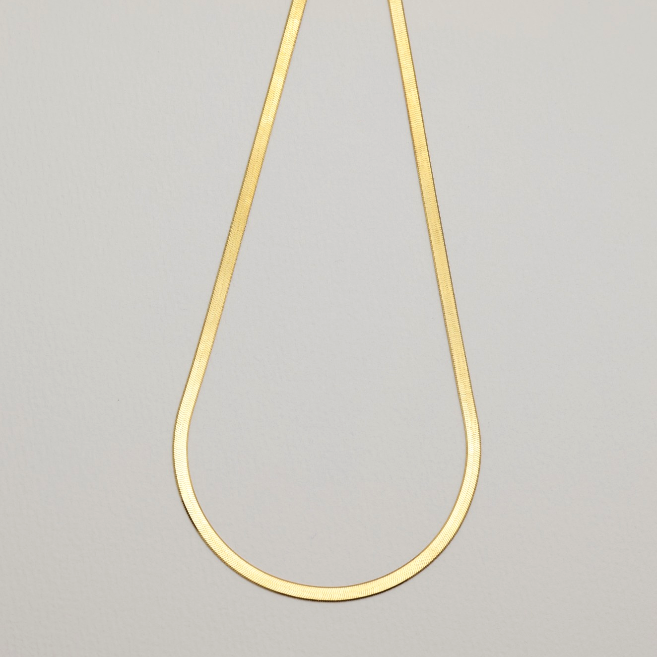 Full view of Margaux Herringbone Necklace in gold vermeil with lobster clasp
