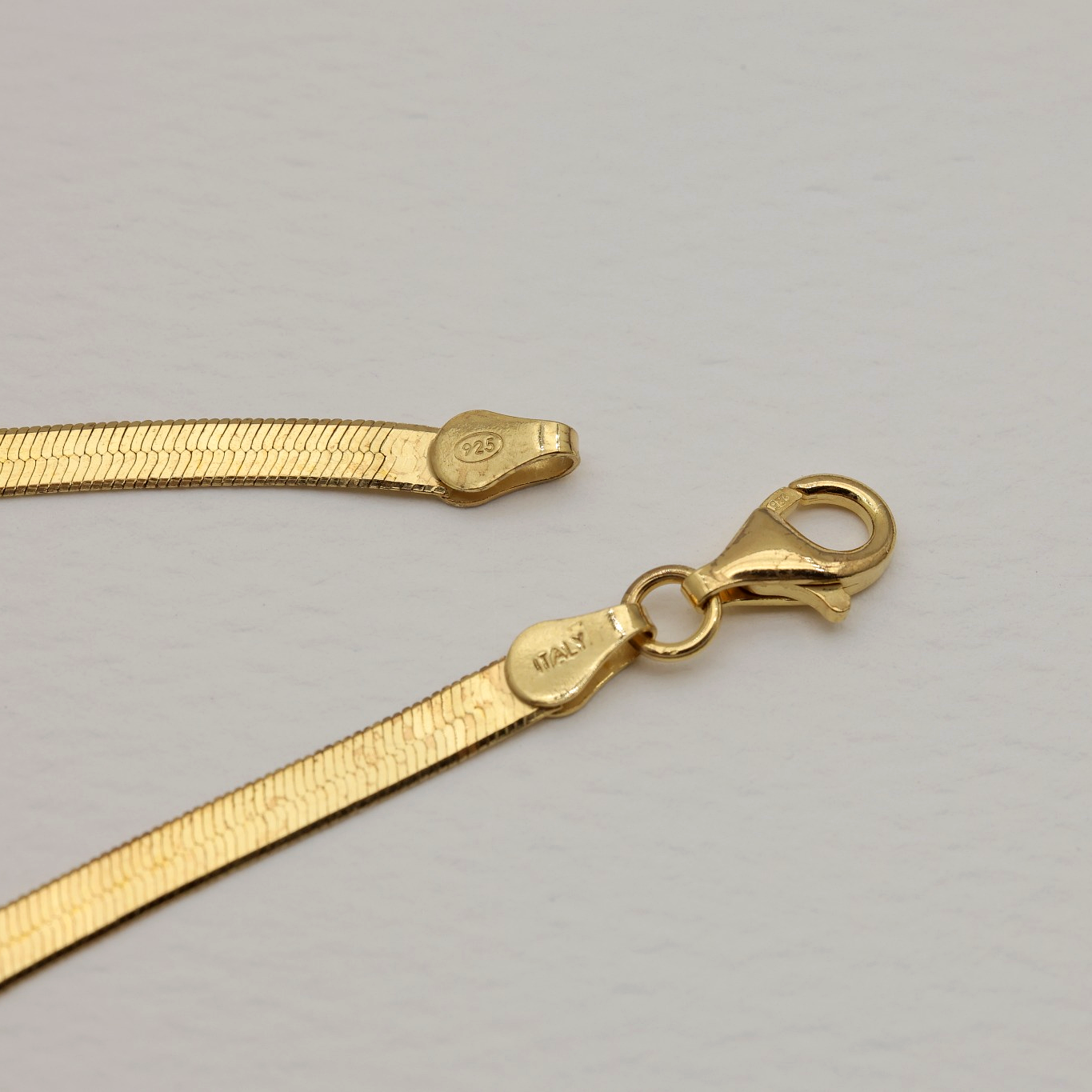 Close-up of 925 and Made in Korea stamp on lobster clasp and chain ends
