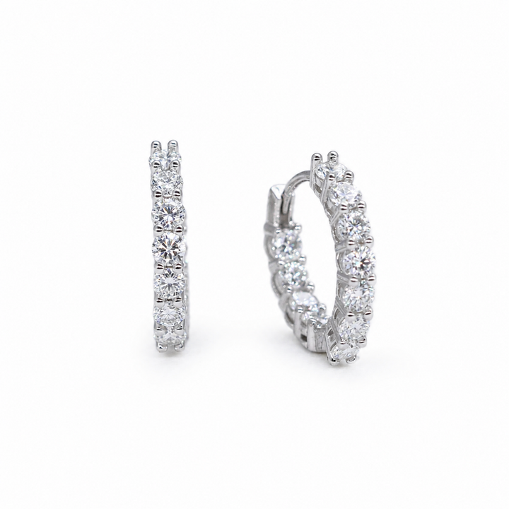 Iséne Huggie Earrings in 925 Sterling Silver on pure white background