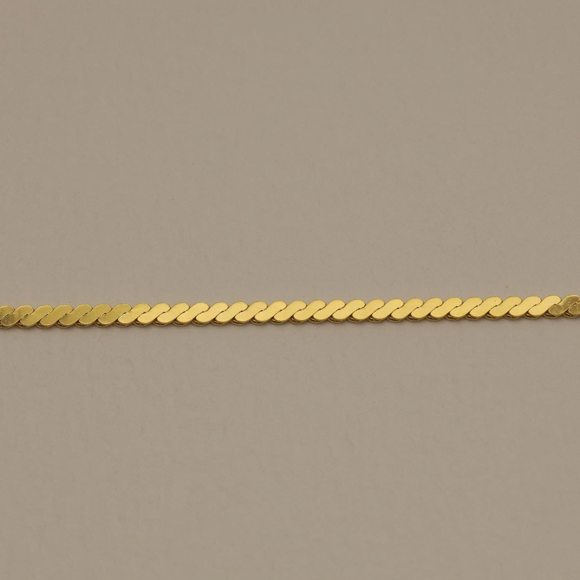 Close-up of the Cléa Necklace chain showing fine twist detail in gold vermeil