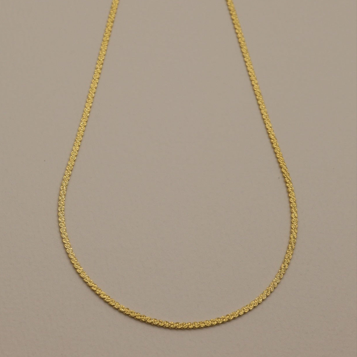Full product shot of the Cléa Necklace with extender on display
