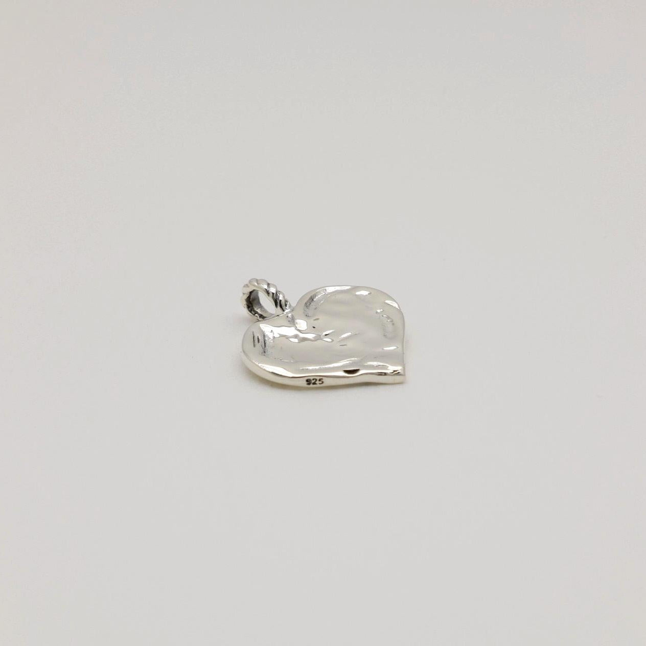 925 sterling silver heart-shaped pendant with soft molten texture and twisted bail, engravable.