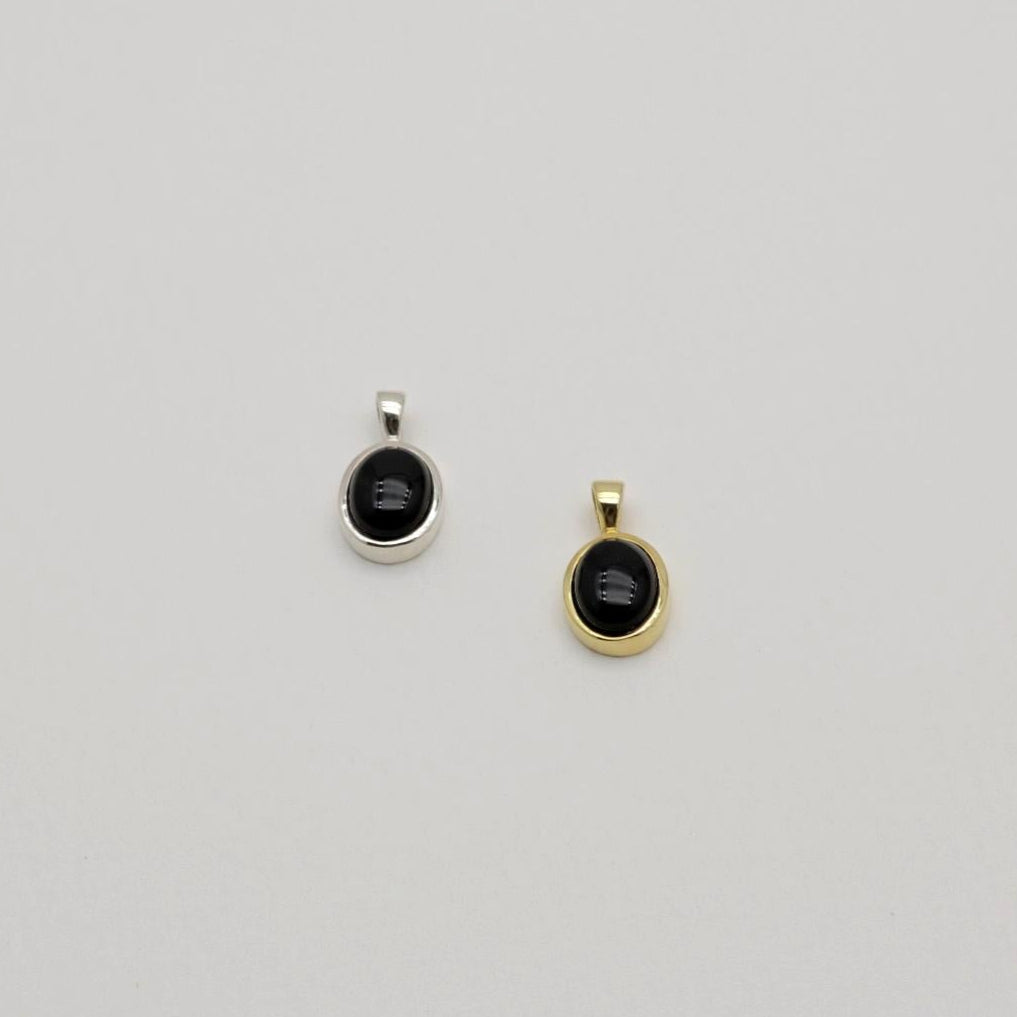 Sterling silver pendant with black onyx stone in a round bezel setting. Clean, minimal, and elegant.