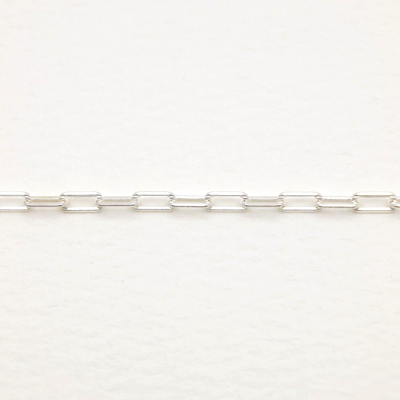 Detail shot of silver rectangular links on Anaëlle Necklace