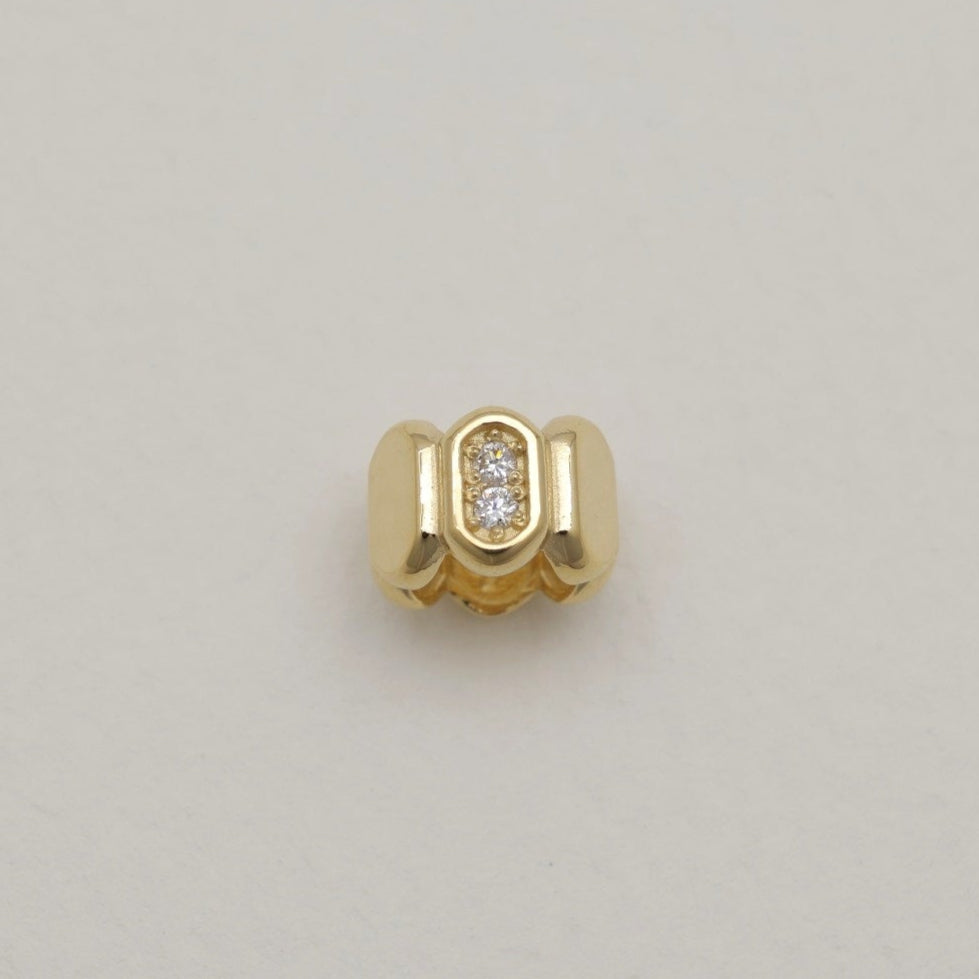 Top view of Orielle pendant with repeating polished segments and pavé stones