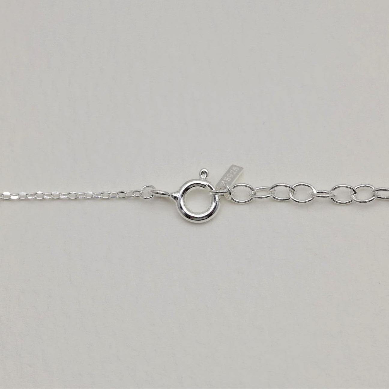 Detail shot of the extender and clasp with 925 silver tag from the Vivienne Necklace.