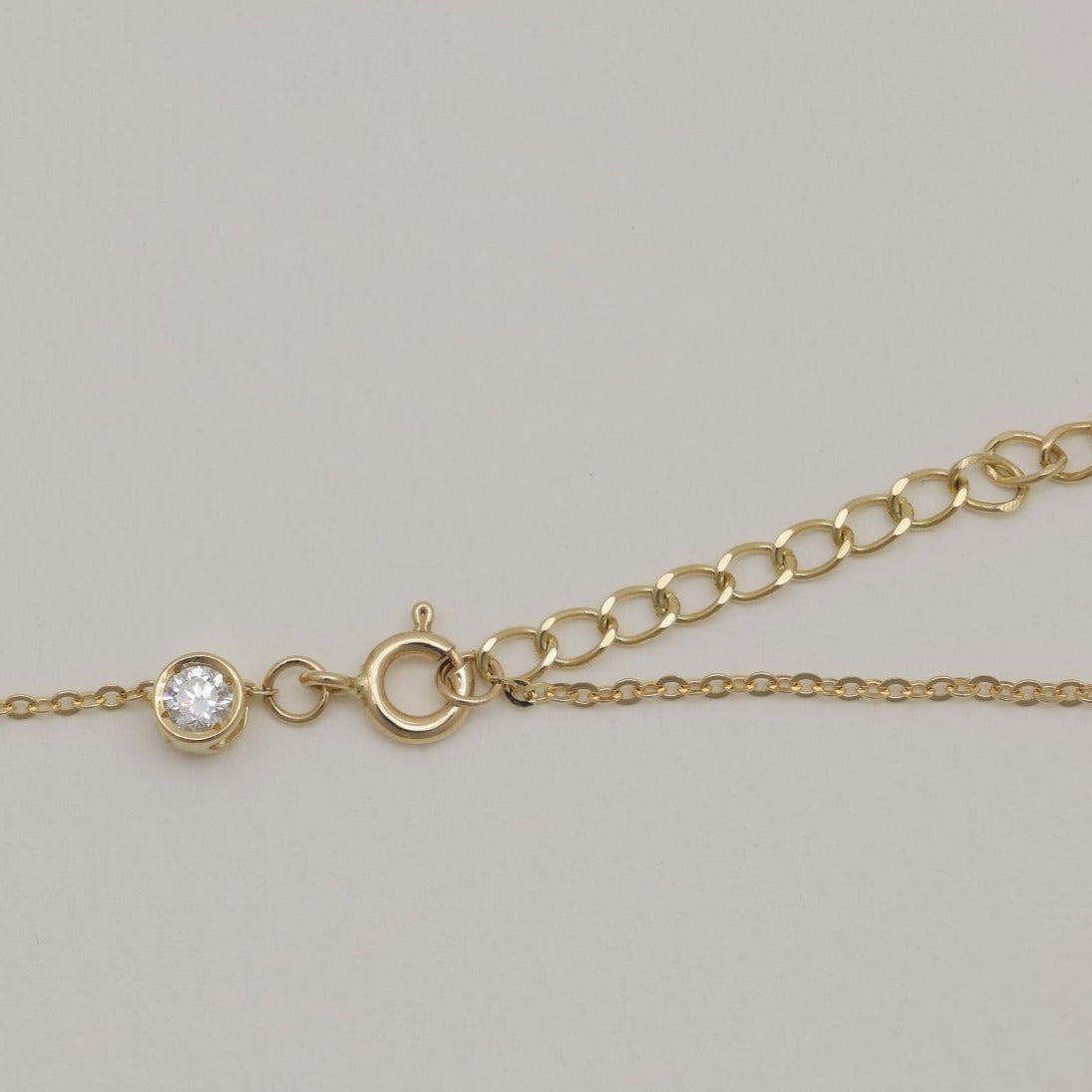 14K gold diamond bracelet with adjustable chain and spring clasp