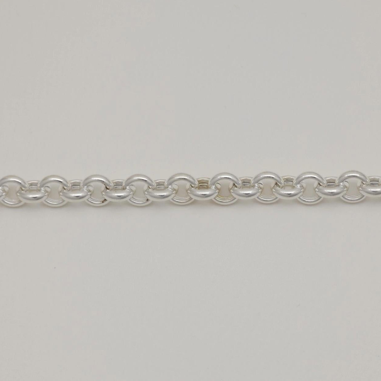 Close-up of Floriane Chain Bracelet in gold vermeil with twisted heart-shaped toggle clasp.