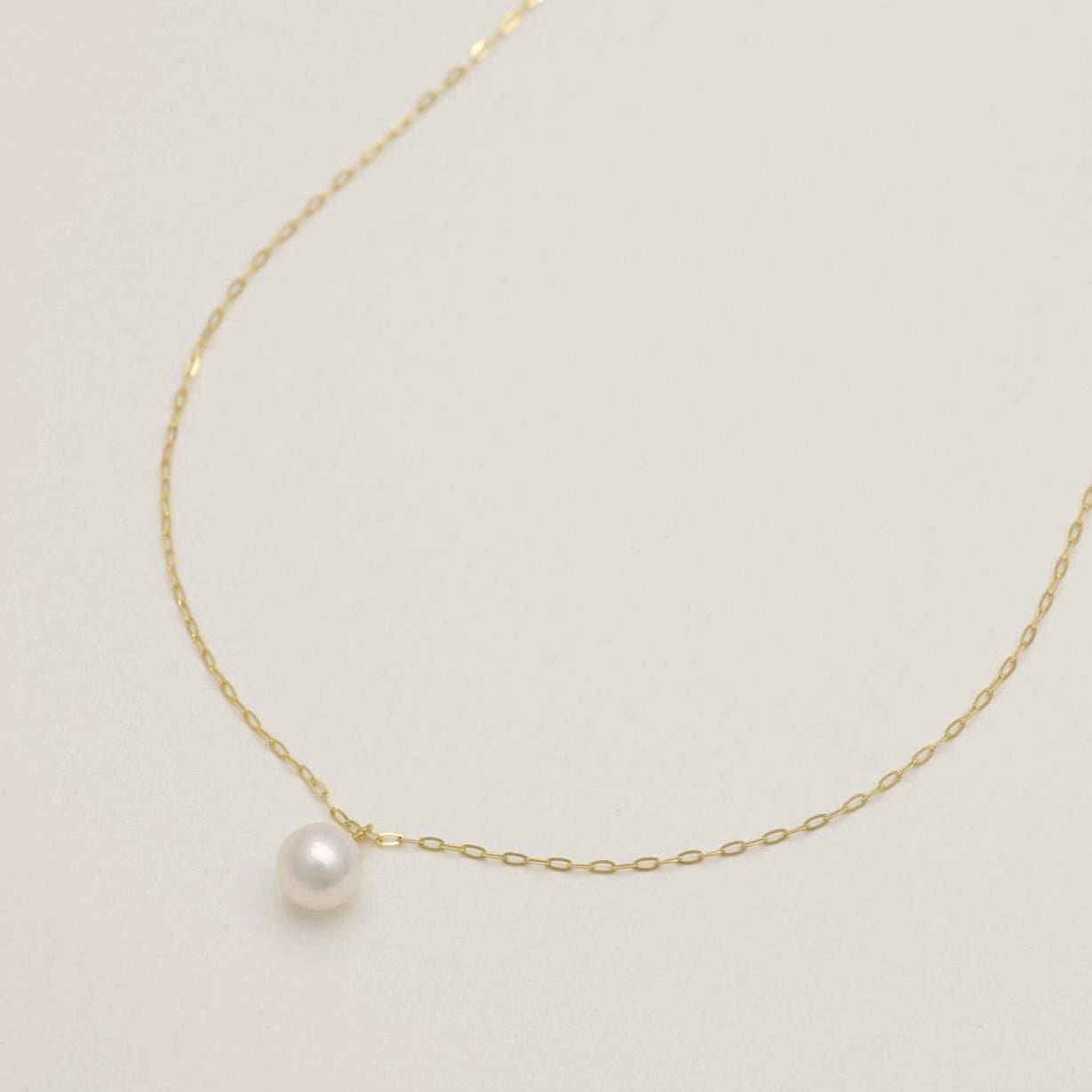 close-up of pearl pendant