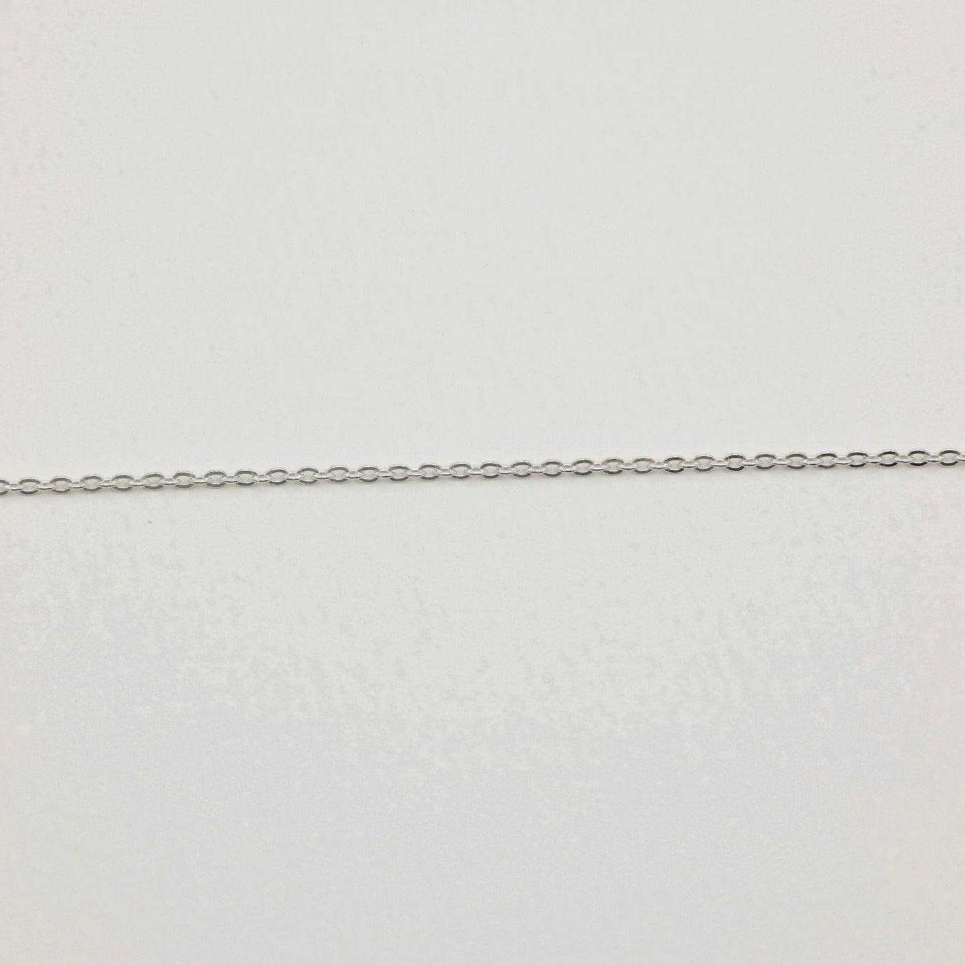 925 sterling silver fine chain necklace, 42cm, shown on neutral background with polished finish and oval links.