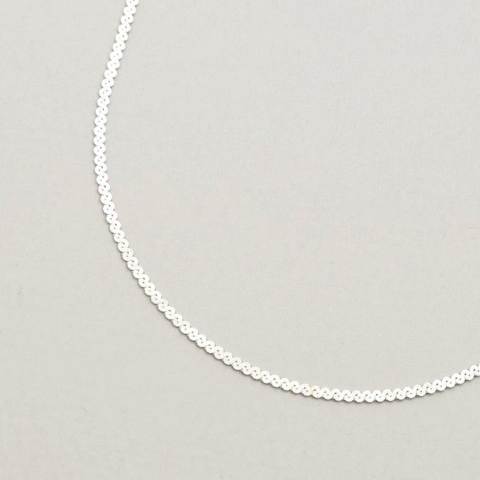 Close-up view of the Delia Chain’s intricate spiral-cut texture in sterling silver.