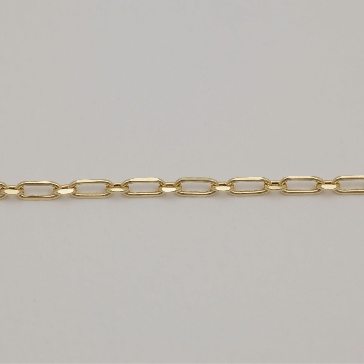 Detailed shot of polished 18K gold rectangular links
