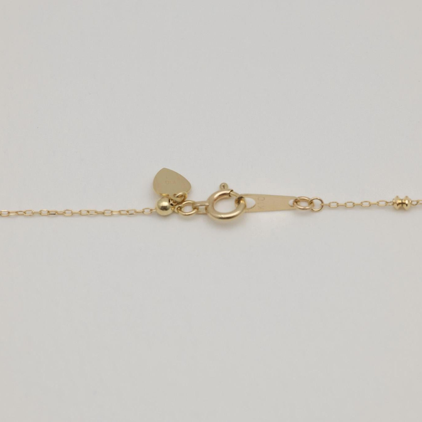 Full view of 10K gold bead chain necklace with spring clasp