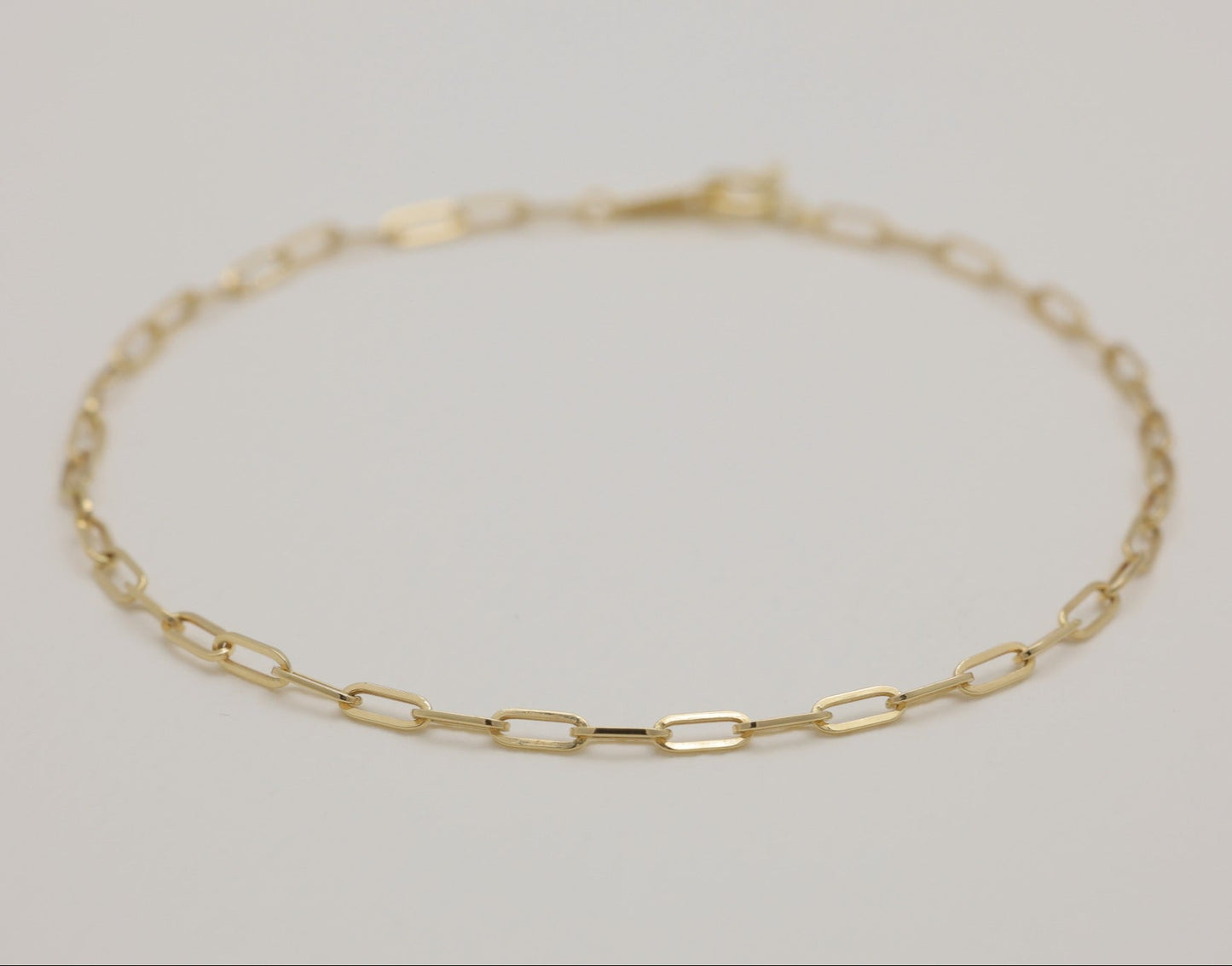 18K gold chain bracelet shown in a full circle, minimal design