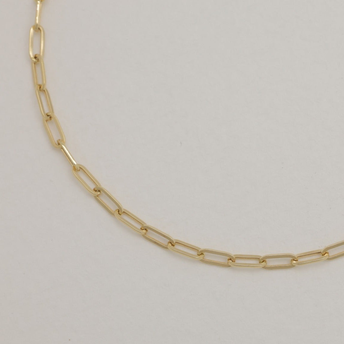 Close-up view of link design in polished 18K gold