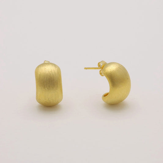 Matte brushed gold vermeil hoop earrings on neutral background, front angle