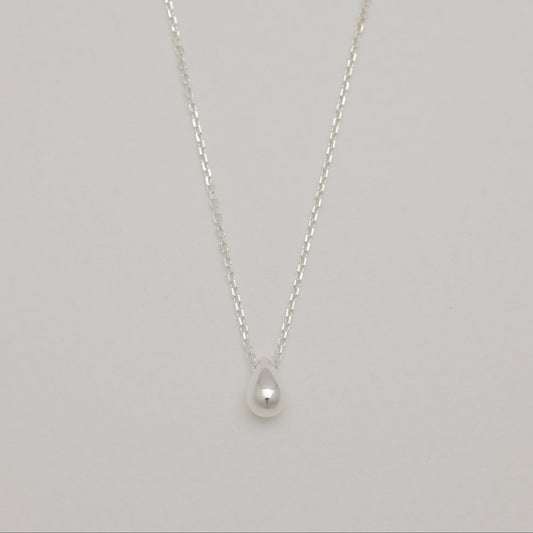 Front view of sterling silver droplet pendant necklace.