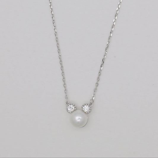 Sterling silver necklace with natural pearl and cubic zirconia accents.