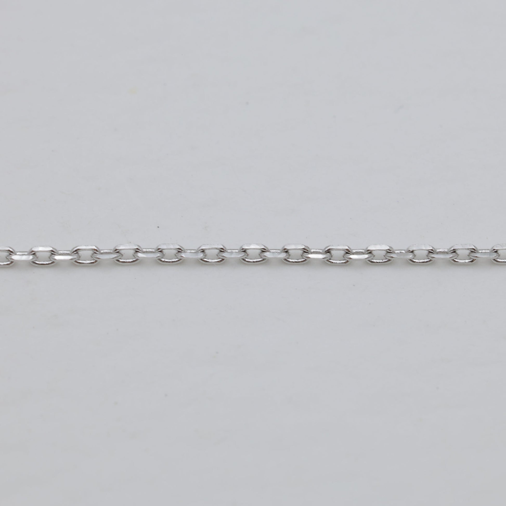 Chain texture detail in polished silver finish.