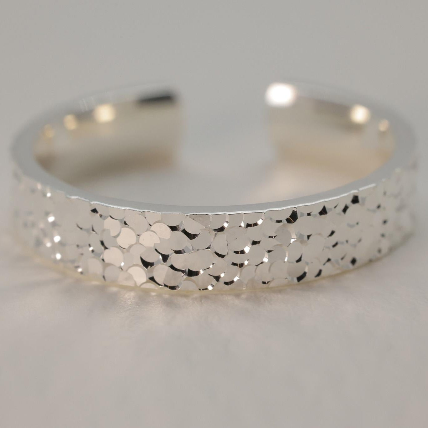 Sterling silver hammered ring with wide band and open back