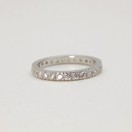 Front view of the Aurore Pavé Ring in sterling silver against a neutral surface.