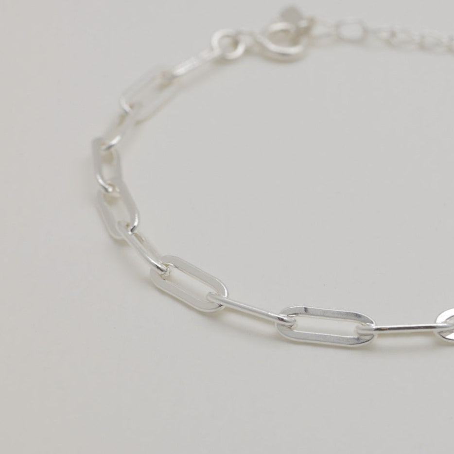 Angled side view of the bracelet showing clasp and extender