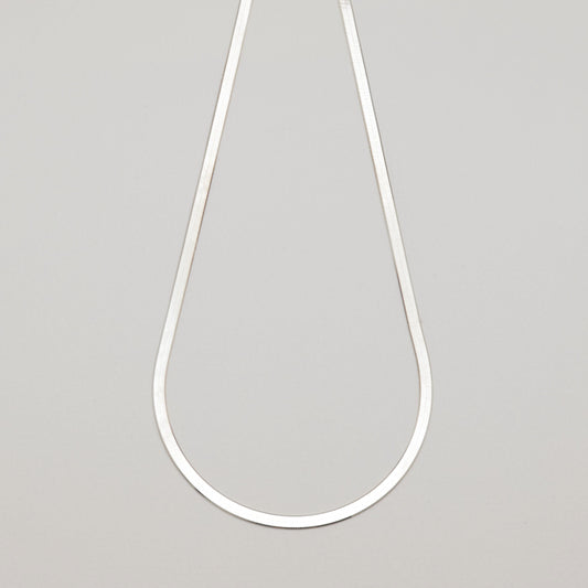 Full view of the Margaux Chain Necklace in sterling silver laid flat on neutral background