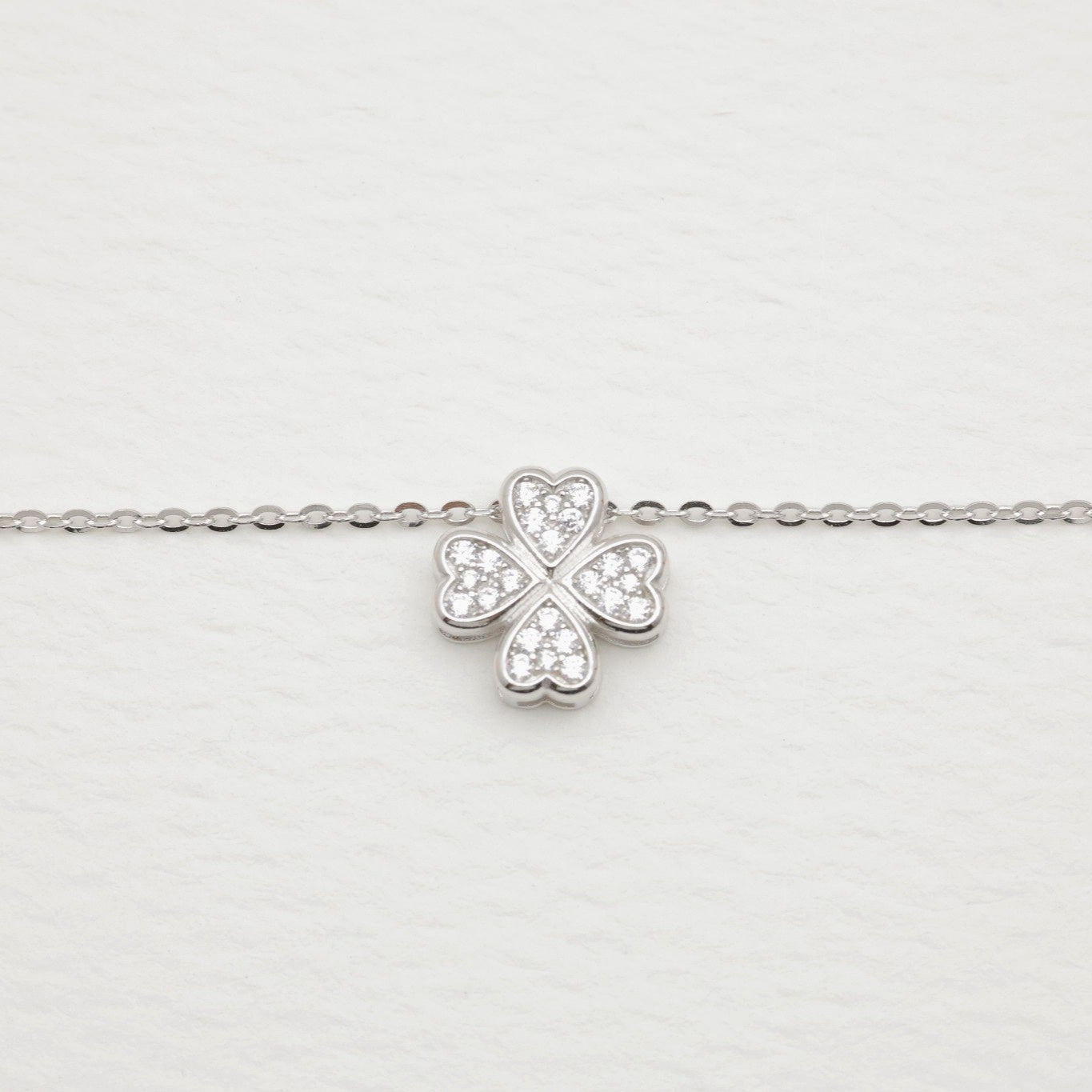 Side view of the Fleur pendant showing its sculpted depth and polished finish