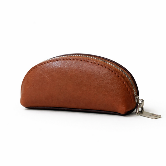 MOA golden brown leather mini zip pouch with silver zipper on a clean white background