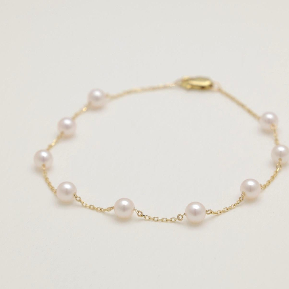 Pearl bracelet on a light beige background