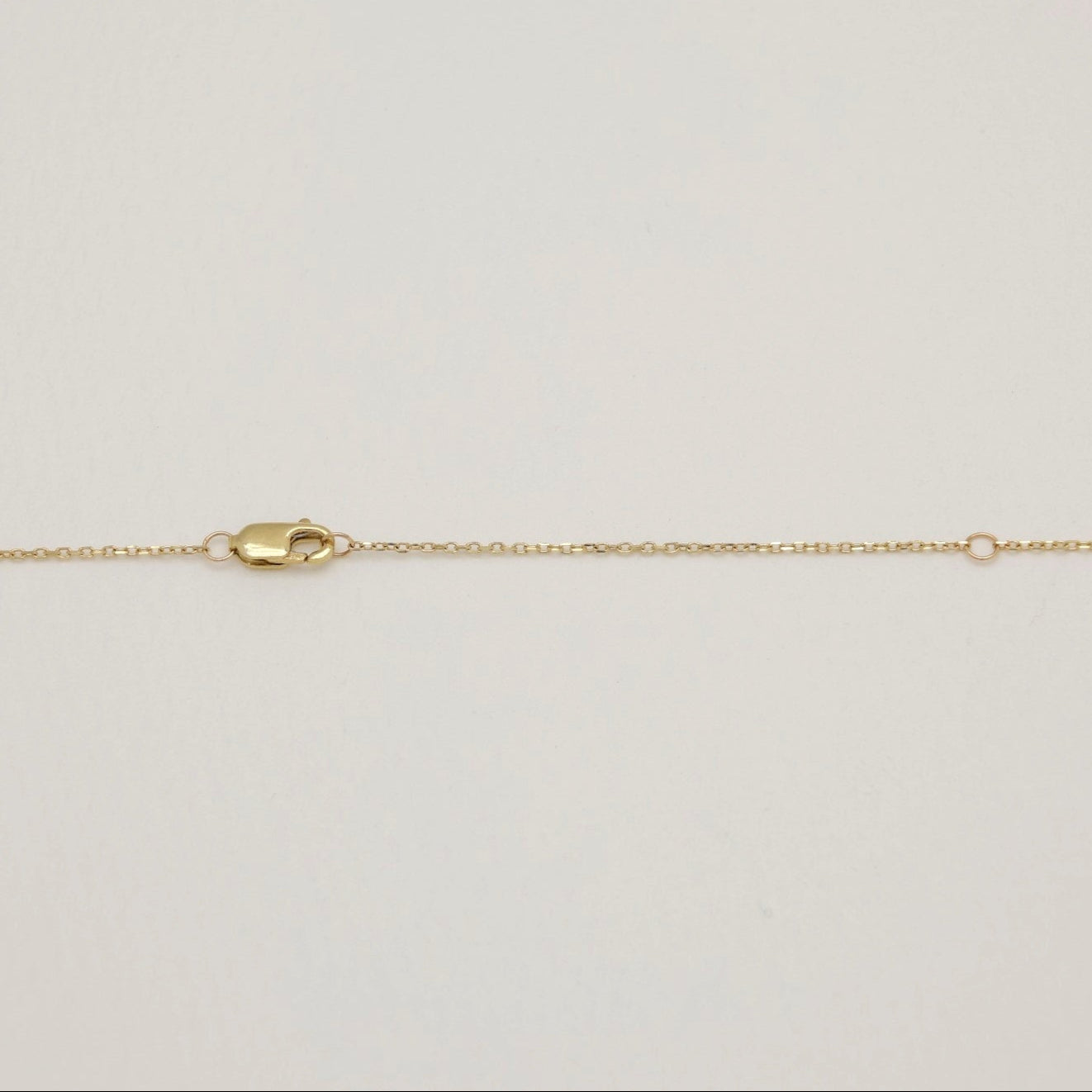 Gold chain on a light background