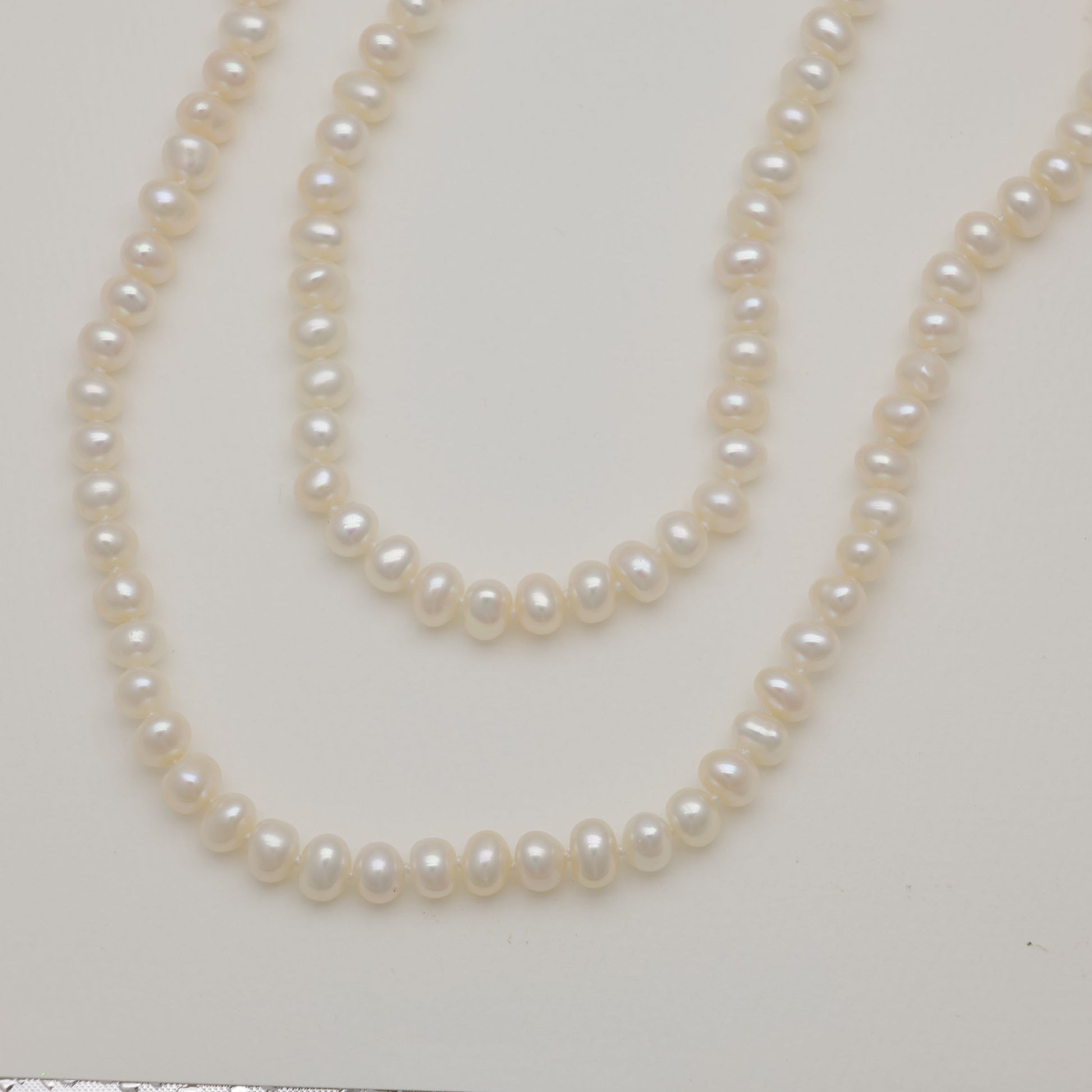 Pearl necklace on a white background