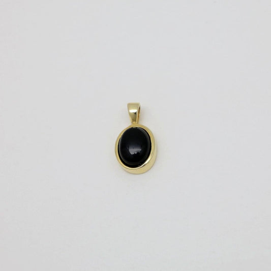 Arianne gold vermeil pendant with oval onyx stone on neutral background