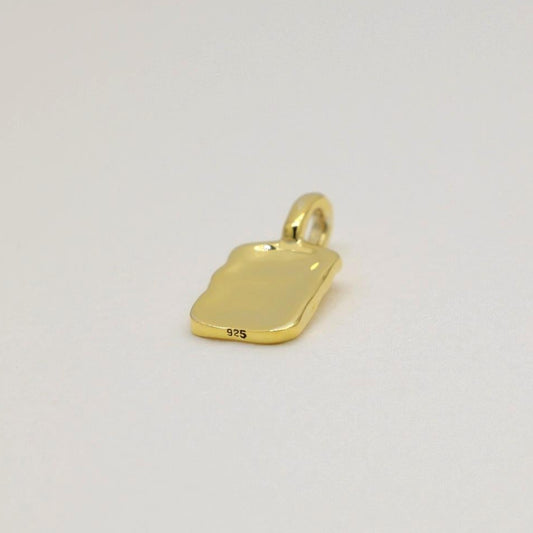 Gold vermeil rectangular tag pendant with soft rippled texture, photographed on a neutral background.