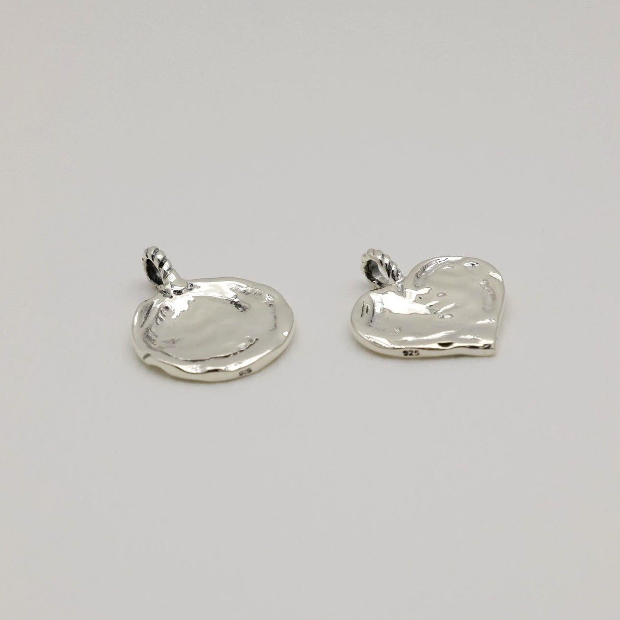 925 sterling silver heart-shaped pendant with soft molten texture and twisted bail, engravable.
