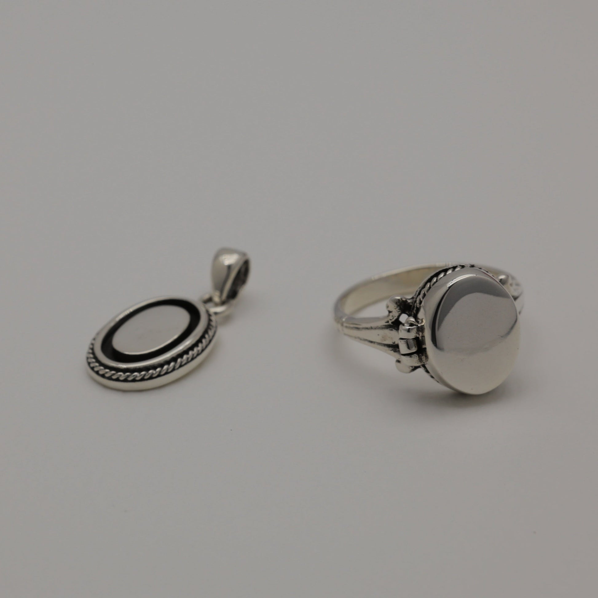 Sterling silver oval pendant with polished centre and oxidized rope edge, shown alone and styled with matching Séraphine ring.
