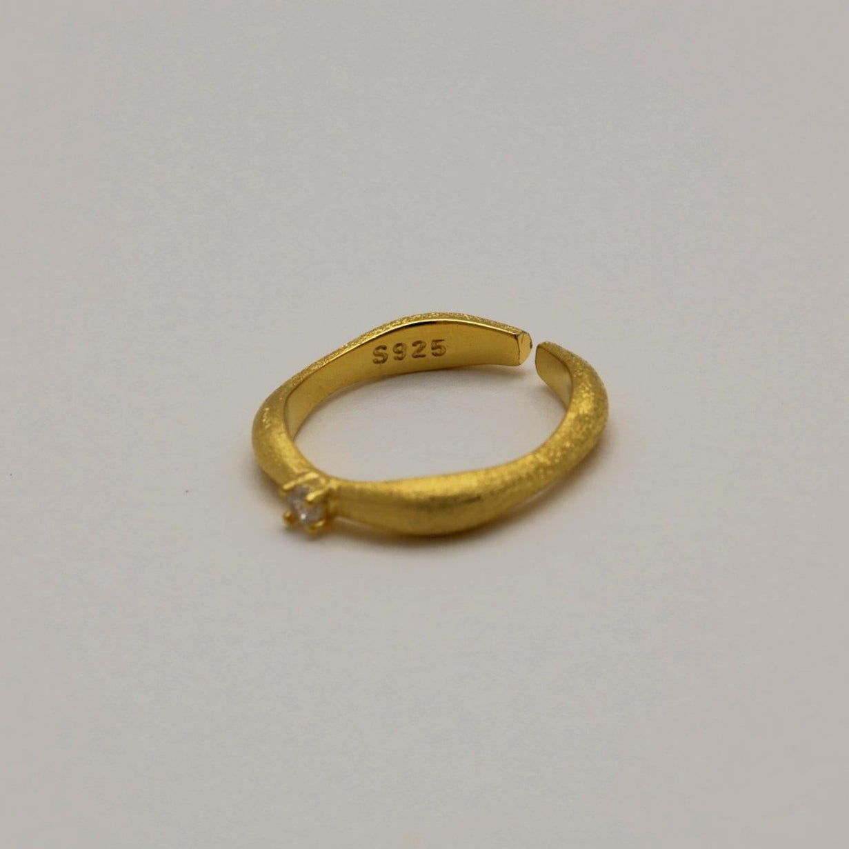 Minimalist gold ring with solitaire cubic zirconia detail
