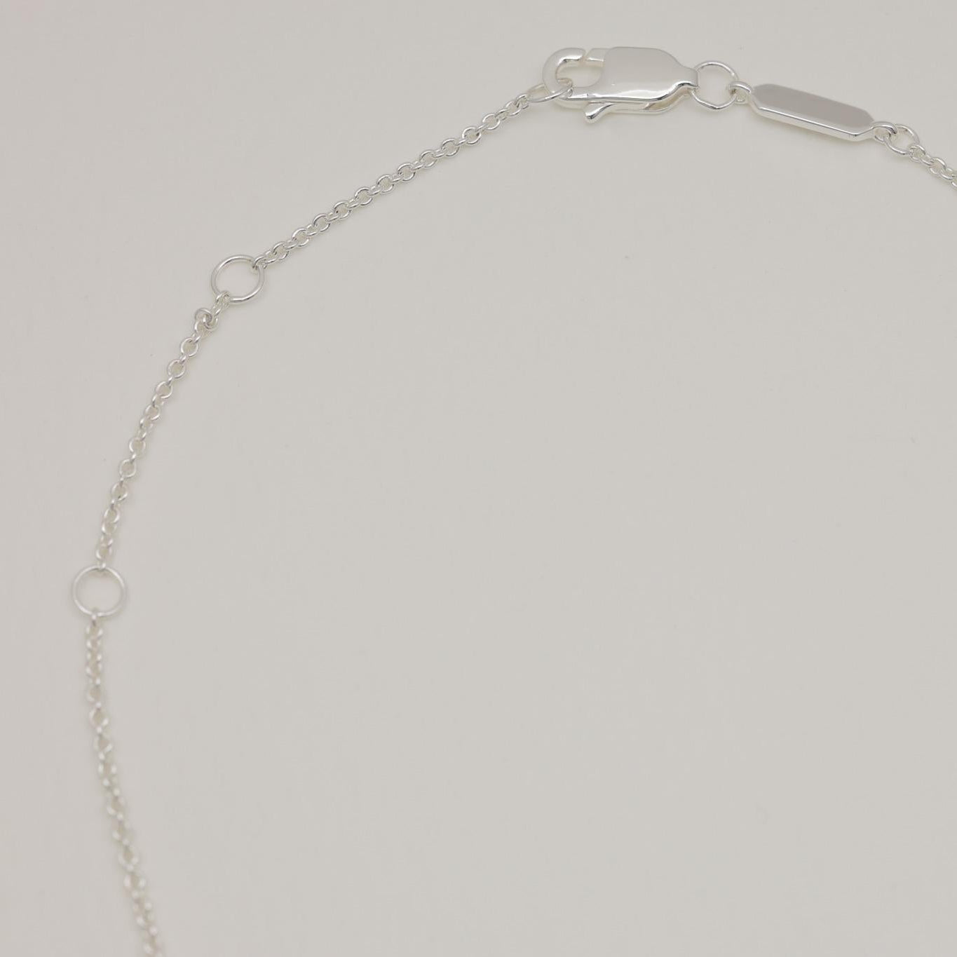 Sterling silver necklace with a smooth round crystal pendant and fine chain, 42cm + 3cm extension.
