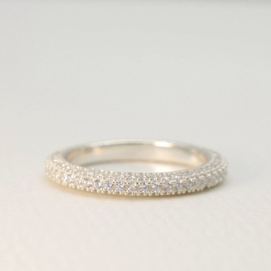 Close-up side view of the Sylvette Pavé Band in sterling silver, showing its triple pavé design.