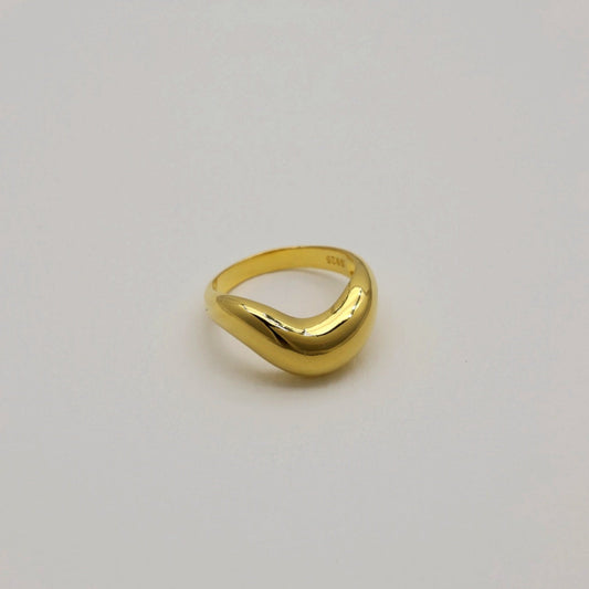 Side angle of the Ondine Sculptural Ring in Gold Vermeil, showing its curved contour.