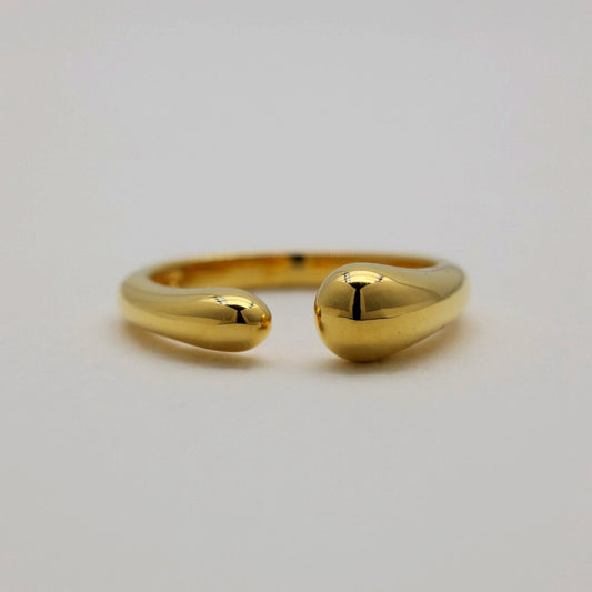 Front-facing image of the gold vermeil Delphine ring displaying its bulbous teardrop ends