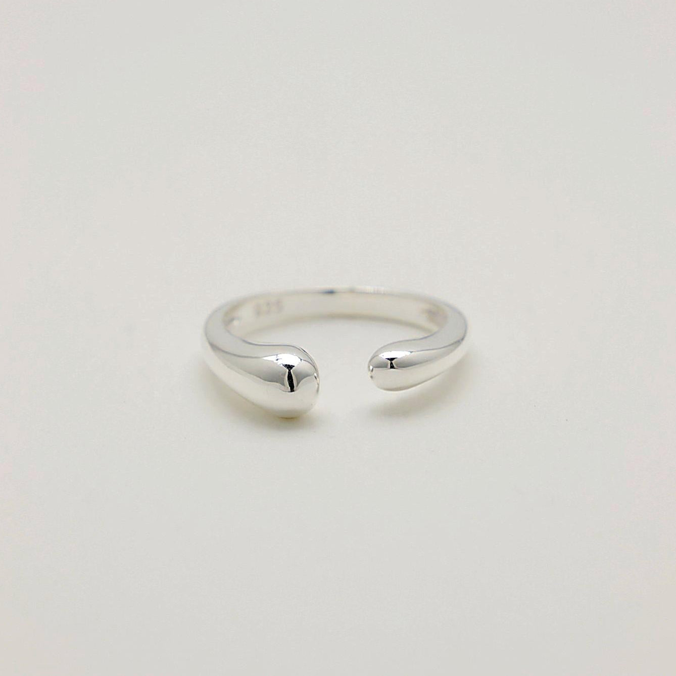 Front-facing view of the Delphine Curve Ring highlighting its fluid, sculptural design in sterling silver.