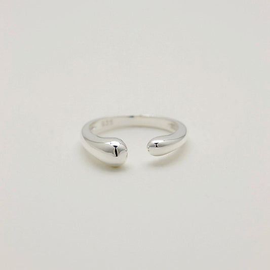 Front-facing view of the Delphine Curve Ring highlighting its fluid, sculptural design in sterling silver.