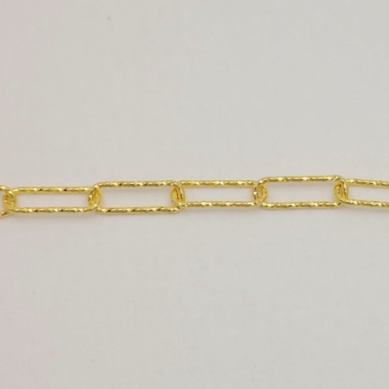 Close-up of Cédrine Bracelet’s textured elongated gold links

