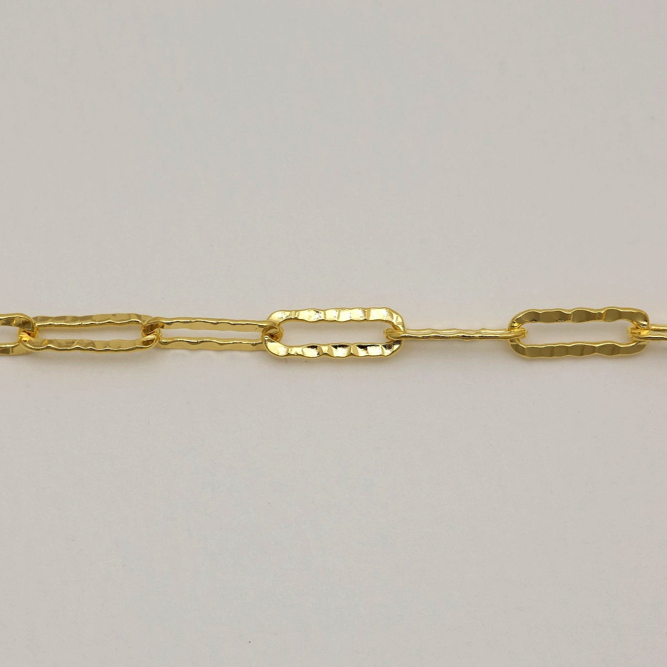 Close-up of hammered gold vermeil chain bracelet design

