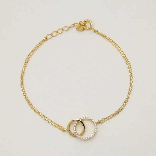 “Gold vermeil bracelet with interlocking circle motif and cubic zirconia”

