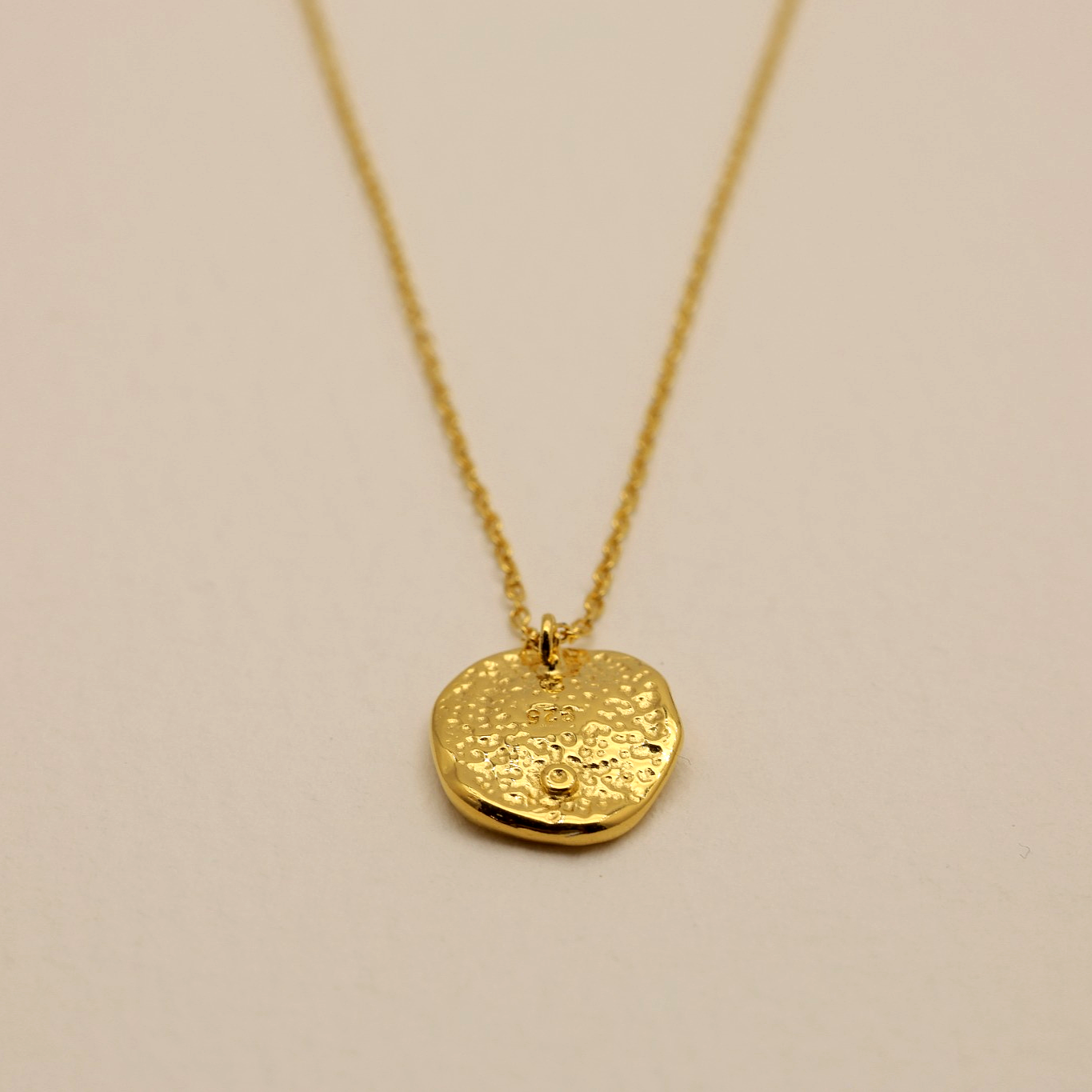 Minimalist sculptural necklace with high-shine gold finish by MOA