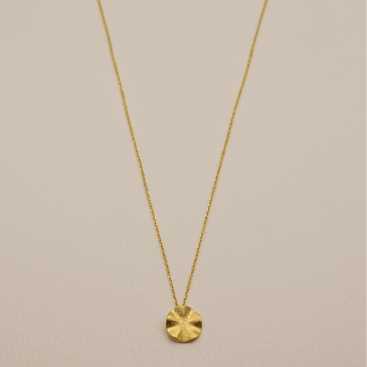 Full view of the Éline Necklace laid flat, highlighting the subtle ripple texture and extension chain.