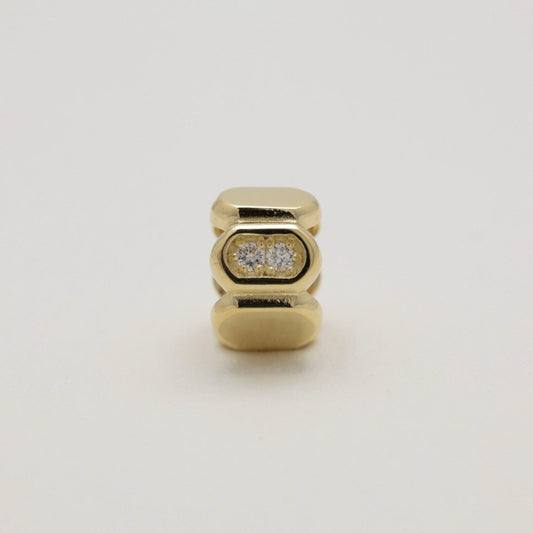 Orielle 14K gold pavé pendant standing upright on neutral background