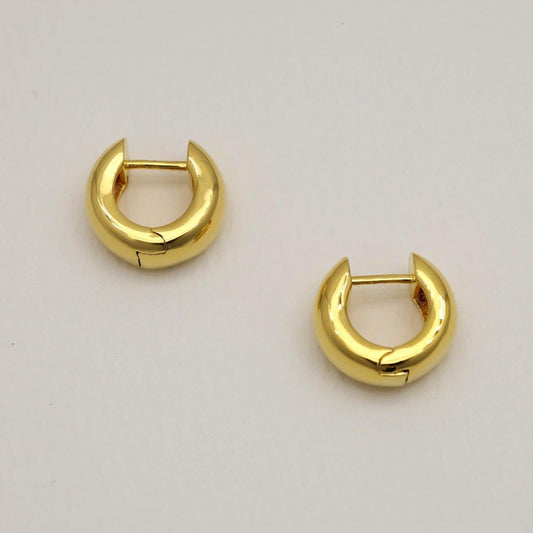 Polished gold vermeil mini hoop earrings with a smooth rounded finish, crafted in Korea.
